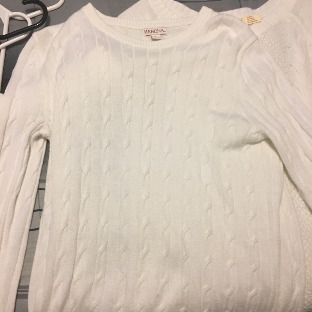 two white sweaters